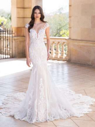Andrea Elysee Bridal Wedding Dress. off shoulder cap sleeve lace dress with double sculpted train