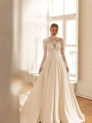 Helly Eva Lendel Wedding Dress. High neck lace long sleeves. Less is more 2022. Chameleon Bride Bournemouth Dorset