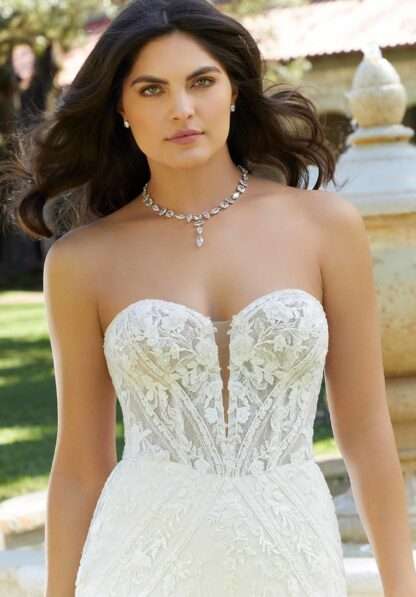 Genevieve 1087 Morilee wedding dress. Strapless graphic modern lace fitted sheath wedding dress with detachable long lace sleeves. 