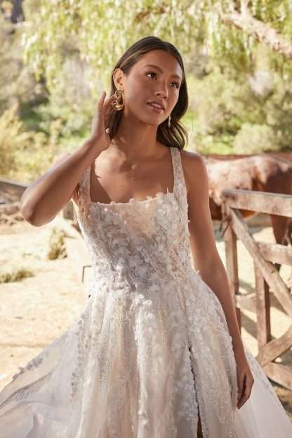 Kassi MJ859 Madison James wedding dress. Square neckline aline wedding dress with beading and sparkle and leg skirt split