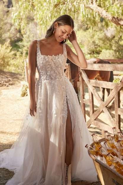 Kassi MJ859 Madison James wedding dress. Square neckline aline wedding dress with beading and sparkle and leg skirt split