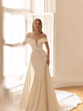 Renata Eva Lendel Wedding Dress. Chameleon Bride Bournemouth Dorset. Plain Off shoulder bardot satin fitted wedding dress with detachable overskirt.