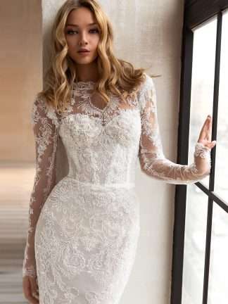 Celine Eva Lendel Wedding dress. Fully beaded high neck wedding dress with small puddle train and long sleeves.