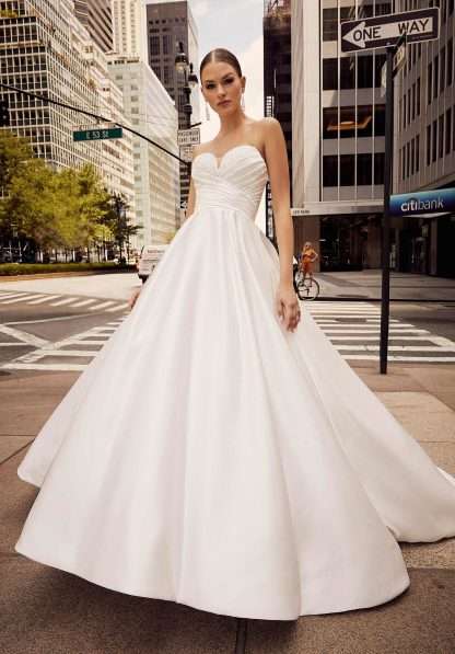 Joyce Morilee 15010 Wedding Dress Chameleon Bride. A strapless sweetheart ballgown with pearls & beading on the bust, plain satin skirt and ruched waist