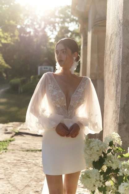 Fiorella Anne-Mariee Bridal Mini short wedding dress with long sleeves. Chameleon Bride Bournemouth Dorset