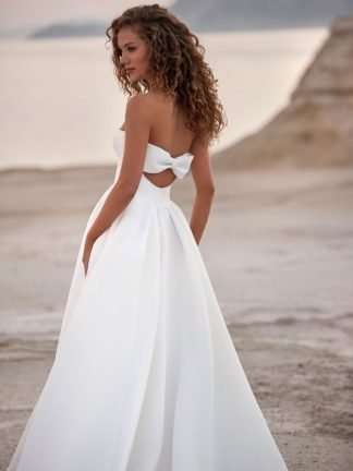 Layla Milla Nova White and LAce. Plain satin ballgown wedding dress with open bow detail on back. Modern brirde. Clean and simple bridal gown. Chameleon Bride Bournemouth Dorset