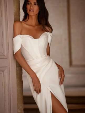 Cora Lorenzo Rossi Milla Nova. Corset boned structured off shoulder strapless wedding dress with skirt split. Chameleon Bride Bournemouth Dorset