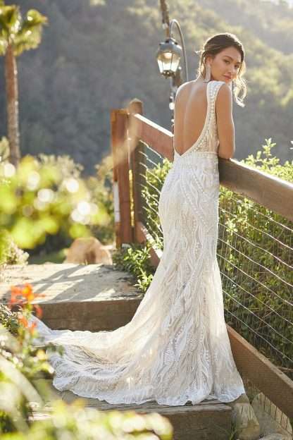 Khloe MJ852 Madison James wedding dress. Boho graphic lace fitted sheath bridal gown with cap sleeve. Chameleon Bride Dorset