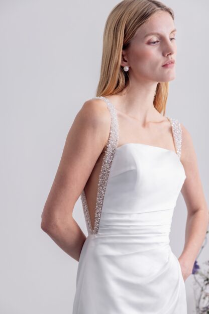Square neck plain satin sheath wedding dress with pearl and crystal detailing. Chameleon Bride Bournemouth Dorset