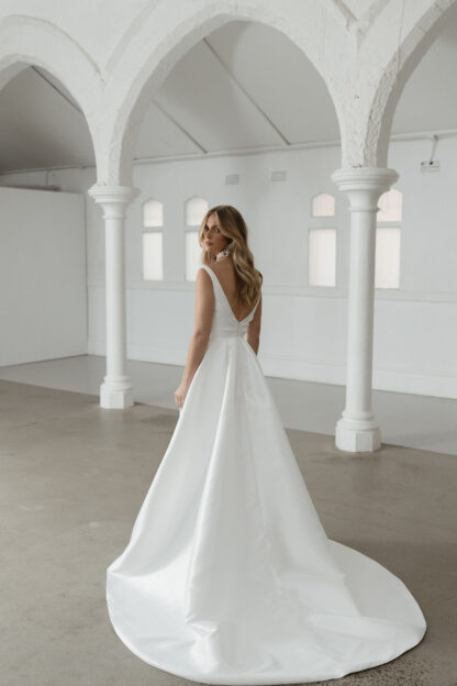 Seldon Madi Lane wedding dress. Plain sating off shoulder bridal gown.