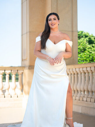 Essense of Australia  Fitted plain stretch crepe plus size wedding dress with boned corset top, off shoulder, modest neckline and leg split Available to try at Chameleon Bride Bournemouth Dorset