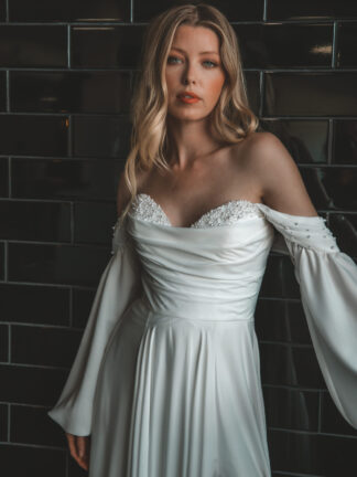 Essense of Australia D4087. Floaty flowy chiffon aline bridal gown with modest neckline, detachable sleeves, leg split and pearl detail.  Available to try at Chameleon Bride Bournemouth Dorset
