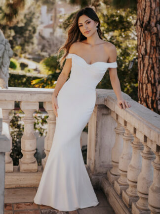 Anya R3653 Allure Romance. Stretch crepe sheath column bridal gown with ruched pleated bust line and off shoulder detail. Available to try at Chameleon Bride Bournemouth Dorset