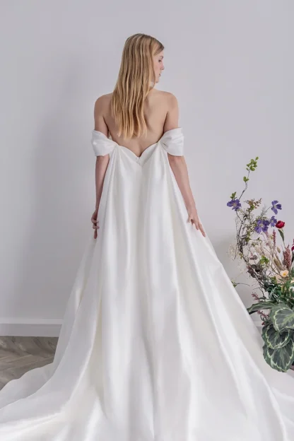 Callaghan wedding dress. Strapless sweetheart plain sating aline wedding dress with ballgown skirt, detachable off shoulder cuff straps and cape.  Dress Available in UK12/UK14 By Teresa Atelier PN1025 Chameleon Bride Bournemouth Dorset