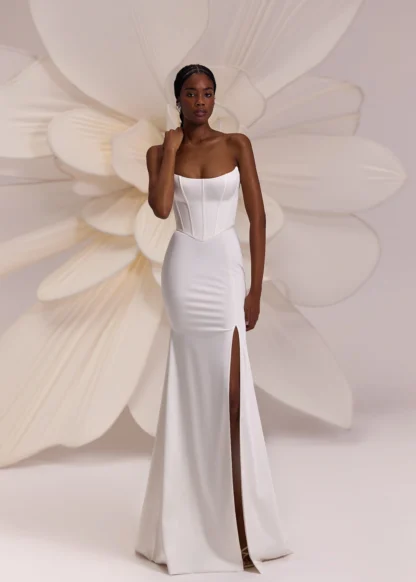 Calgary Eva Lendel wedding dress. Basque cats eye neckline bodice seperate with fitted satin skirt and puddle train. Chameleon Bride Bournemouth Dorset