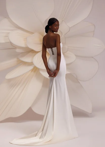 Calgary Eva Lendel wedding dress. Basque cats eye neckline bodice seperate with fitted satin skirt and puddle train. Chameleon Bride Bournemouth Dorset