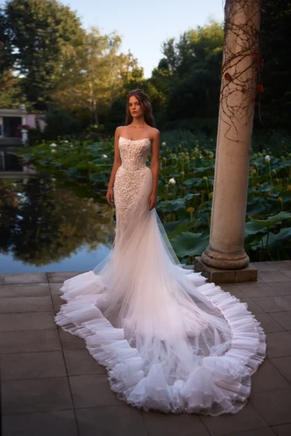Keenley Milla Nova leafy lace sheath wedding dress by Lorenzo Rossi. Paired with a tulle detachable ruffled overskirt. Chameleon Bride Bournemouth Dorset